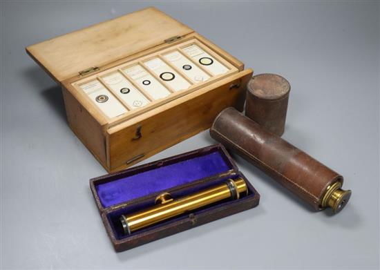 A Victorian cased microscope slides, a leather-cased three drawer telescope and a leather-cased optical instrument